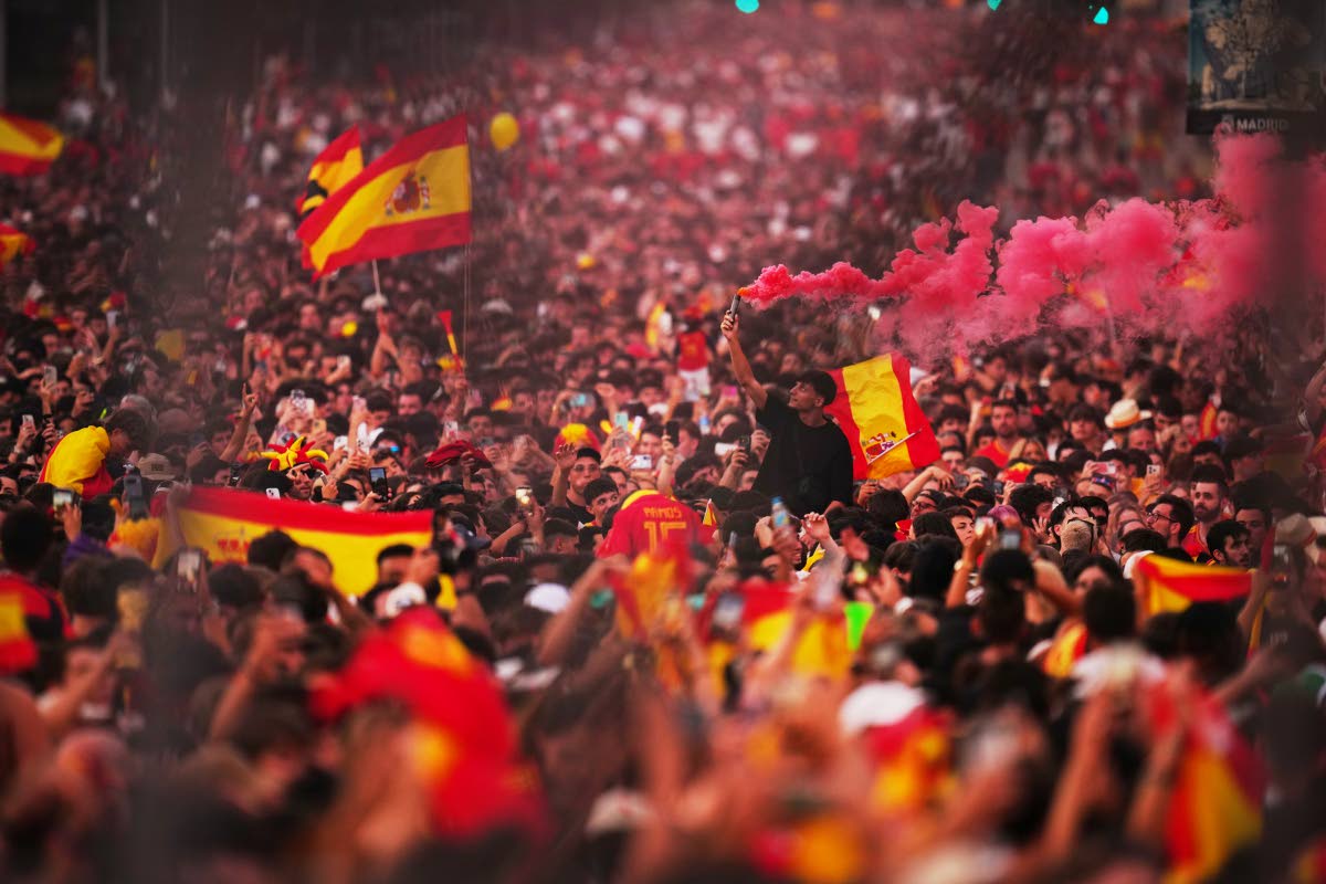 Fans wait for the arrival of players from Spain’s national football team during celebrations in Madrid yesterday after Spain defeated Argentina in the World Cup final in East Rutherford, New Jersey, near New York. 