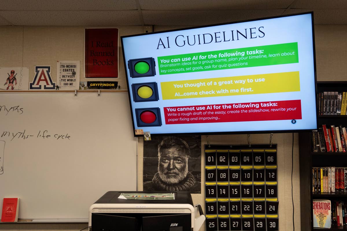 A screen displays guidelines for using artificial intelligence above a portrait of Ernest Hemingway in Casey Cuny’s English class at Valencia High School in Santa Clarita, California, August 27, 2025.