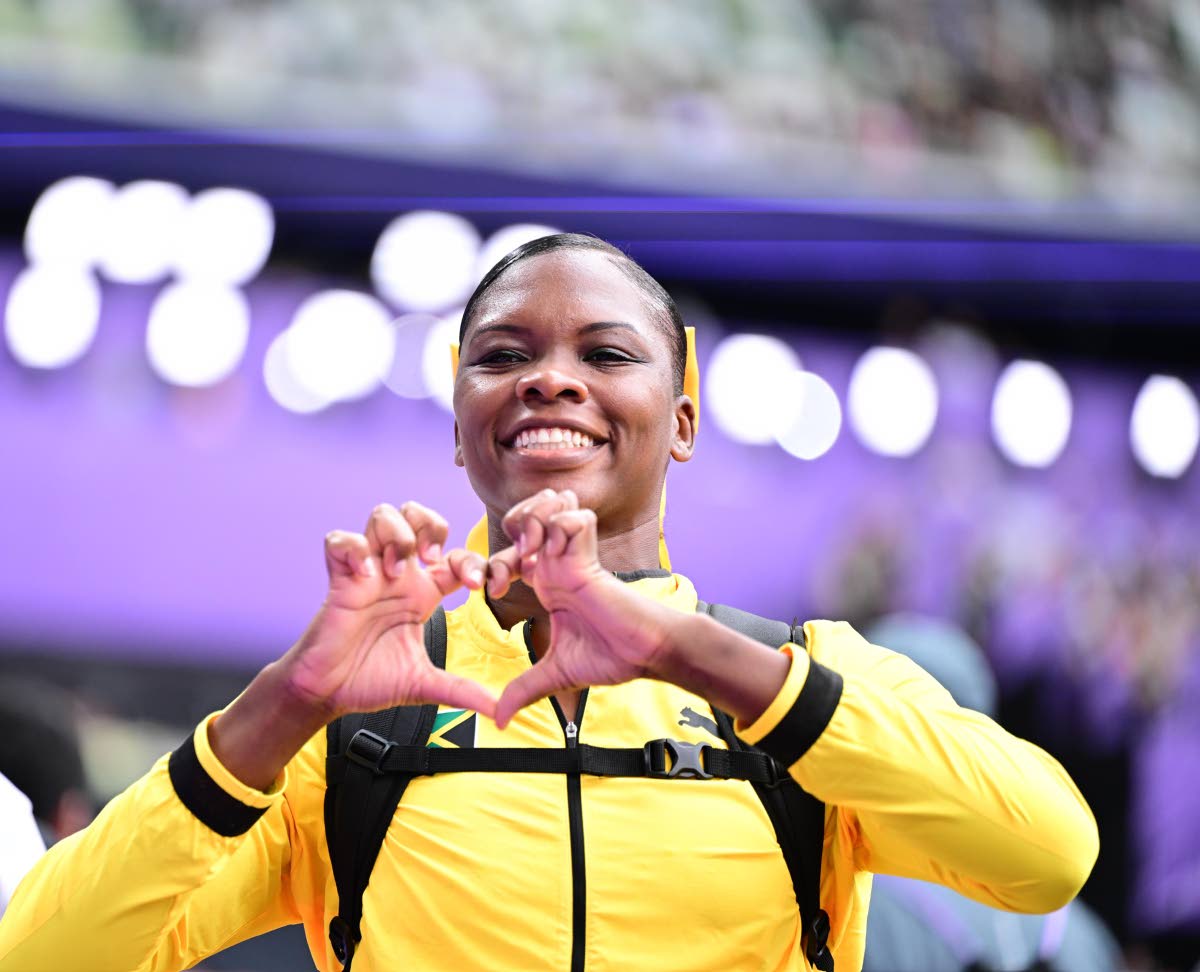 Samantha Hall shows some love after qualifying for the World Athletics Championships discus final at the Japan National Stadium on Friday.