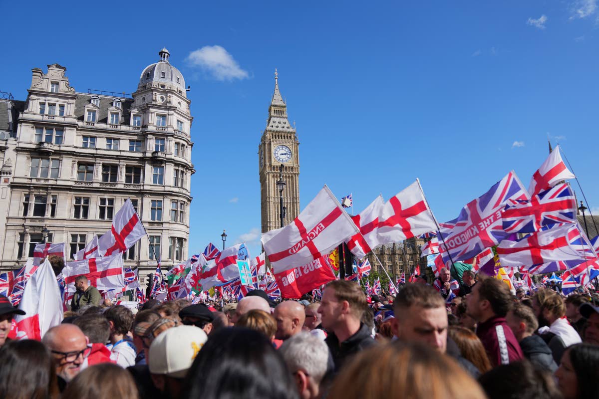 People demonstrate during the Tommy Robinson-led Unite the Kingdom march and rally, in London on Saturday.