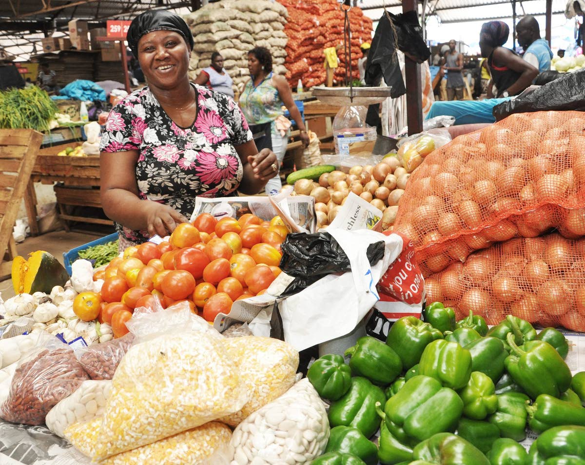 In this  photo, Joy Mc Kenzie- Johnson is seen selling vegetables at Coronation Market, downtown Kingston.