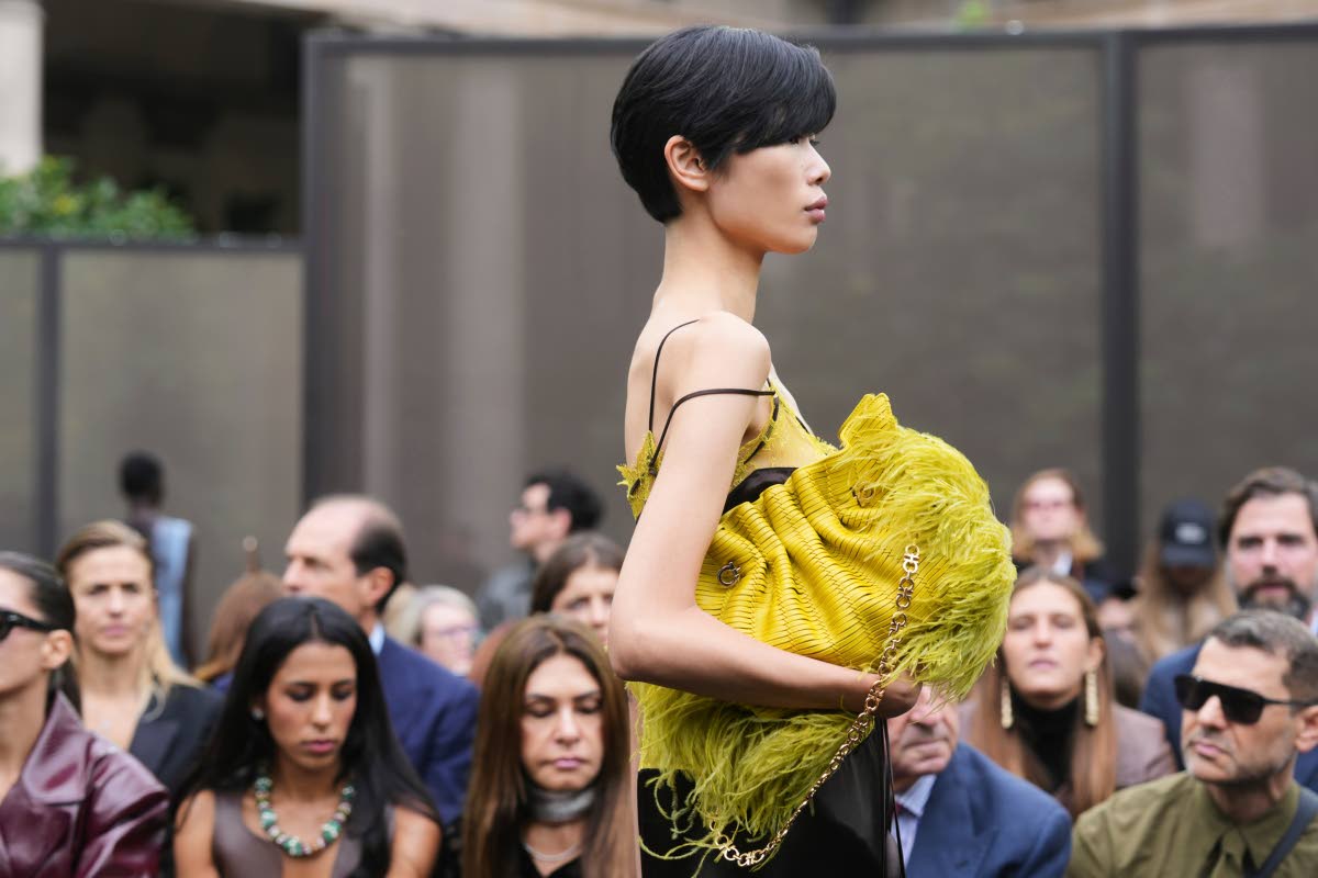 The feathered Ferragamo purse adds movement and texture.