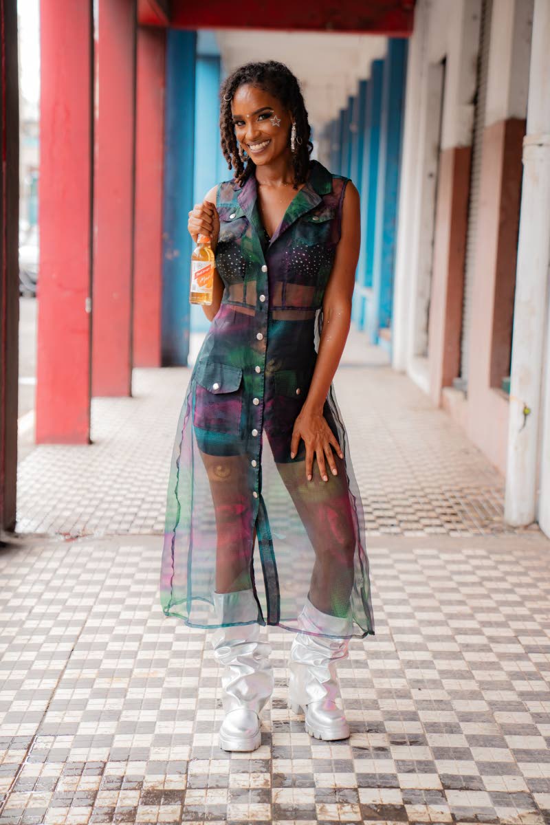 Pepita Little, who hosted the afternoon, stands out in a tailored shorts suit paired with a sheer overlay and metallic silver boots.