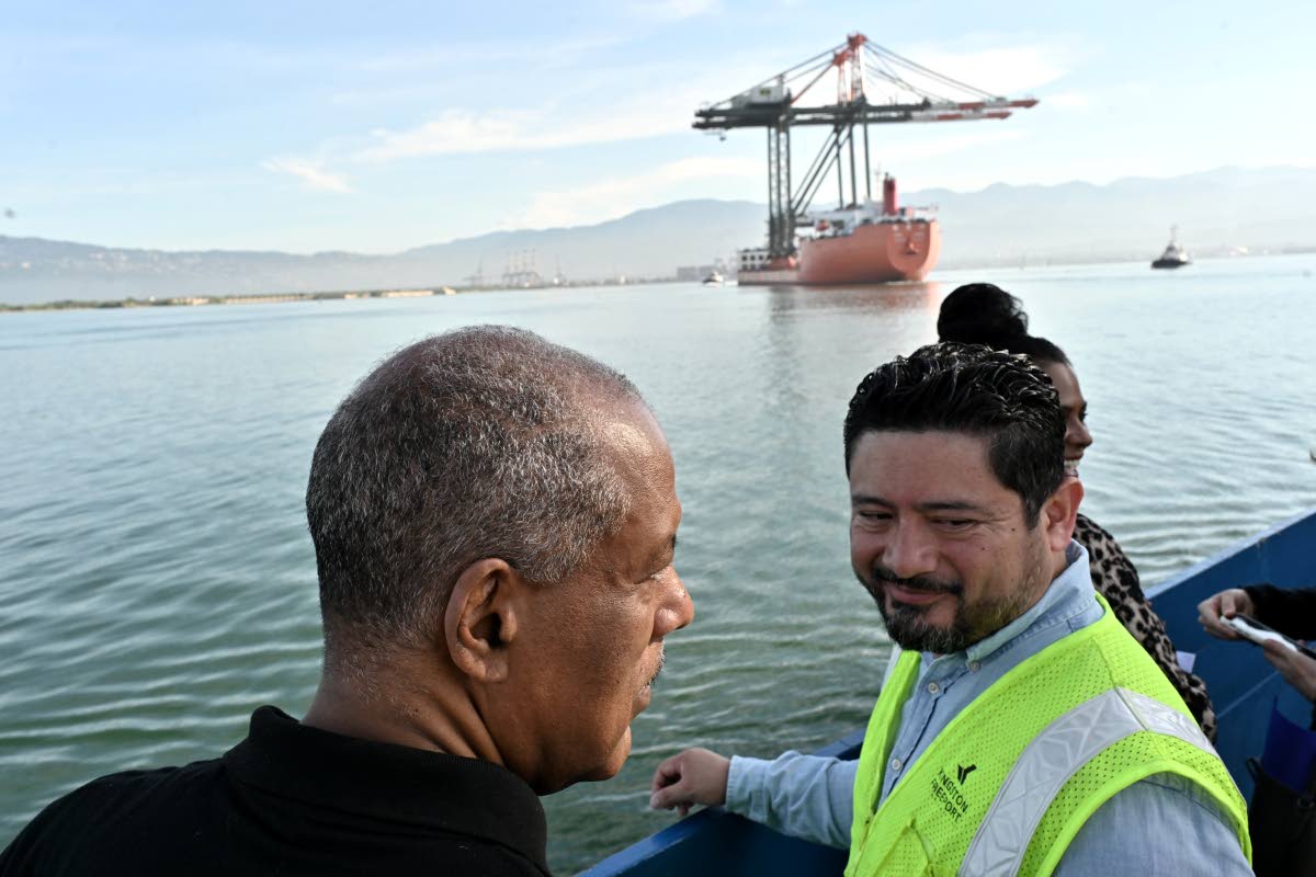 Carlos Cabrera (right), chief operating officer of Kingston Freeport Terminal Limited, and Professor Gordon Shirley, president of the Port Authority of Jamaica; during the arrival of the two new Super Post-Panamax cranes at the Kingston Freeport Terminal y