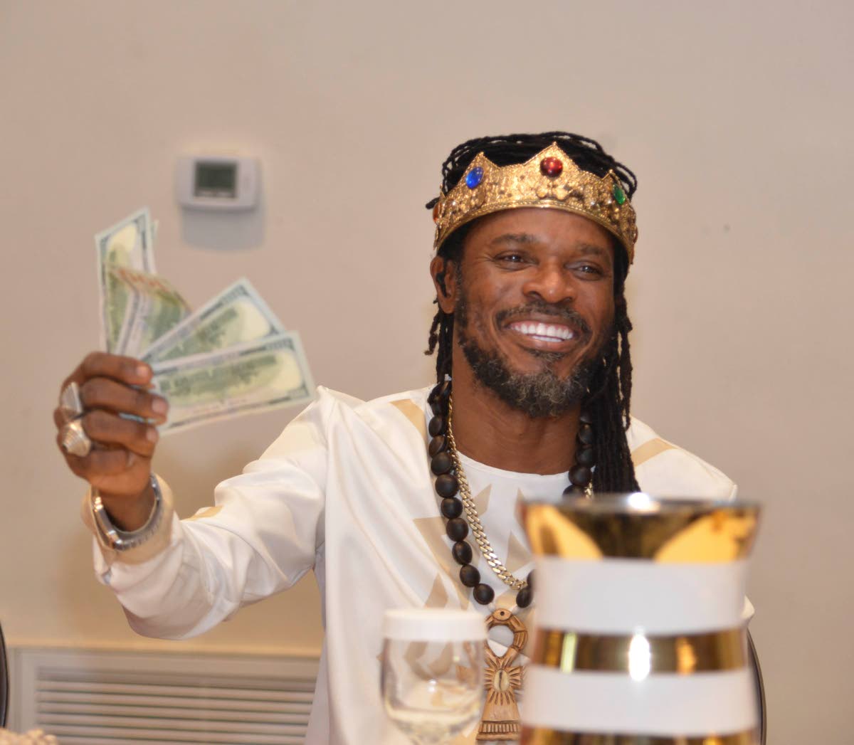 DJ-turned-Maroon-Emperor LA Lewis is all smiles as he shows part of the contribution collected by Owhe during the launch of the amended constitution at the ballroom of The Jamaica Pegasus hotel in New Kingston.