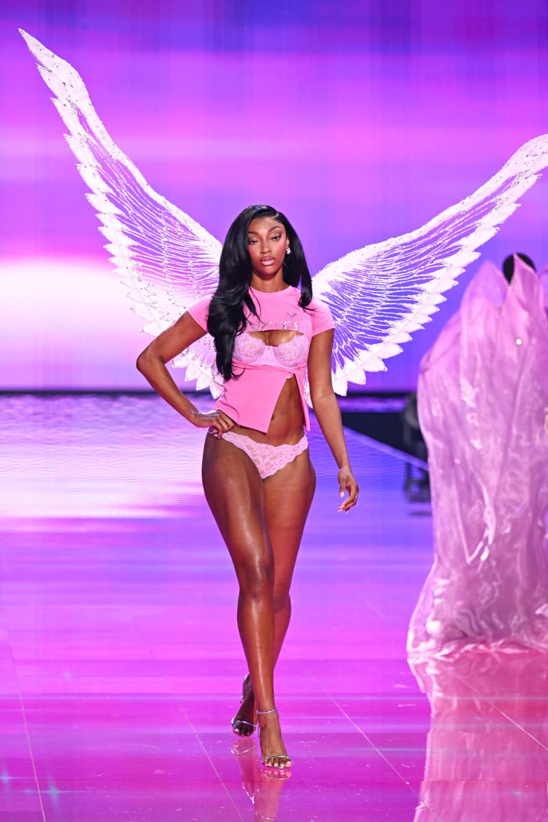 Angel Reese donned the signature angel white wings in her second look. 