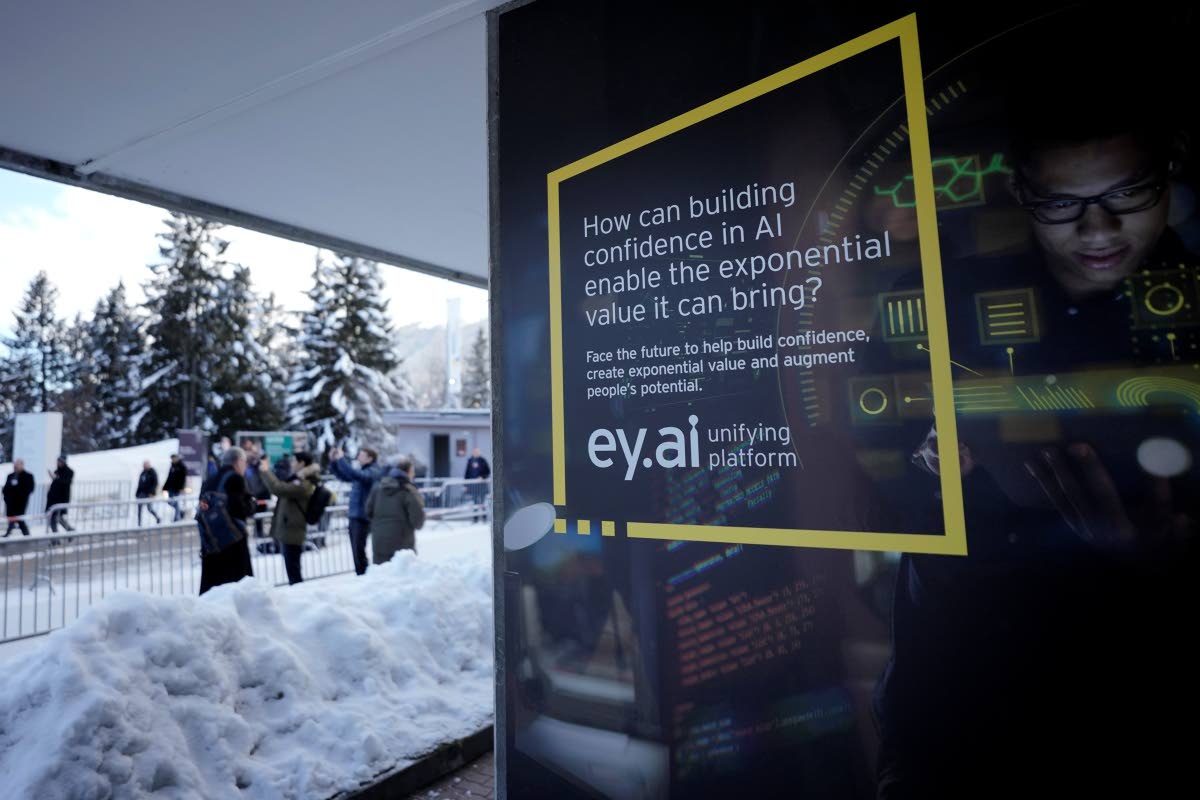 In this January 15, 2024 photo, an advertisements points to the new AI technology displayed at the Davos Promenade alongside the World Economic Forum in Davos, Switzerland.