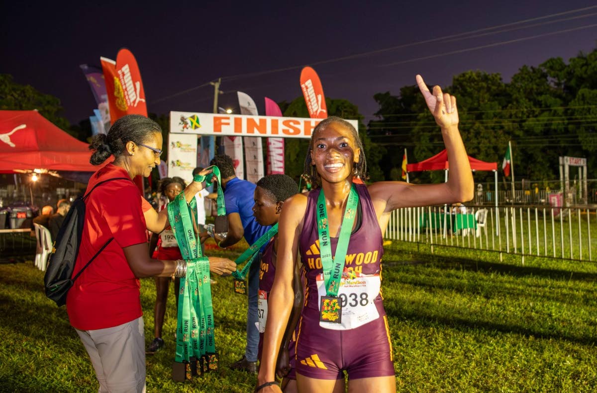 Cindy Rose poses with pride after dominating the 2024 Reggae Marathon with a first-place finish.