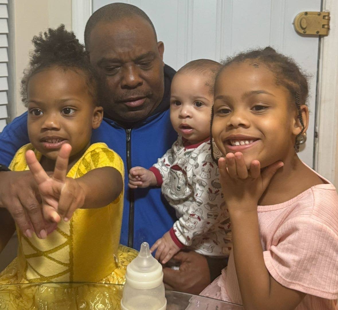 Sixty-five-year-old US Army veteran Godfrey Wade with three of his grandchildren.