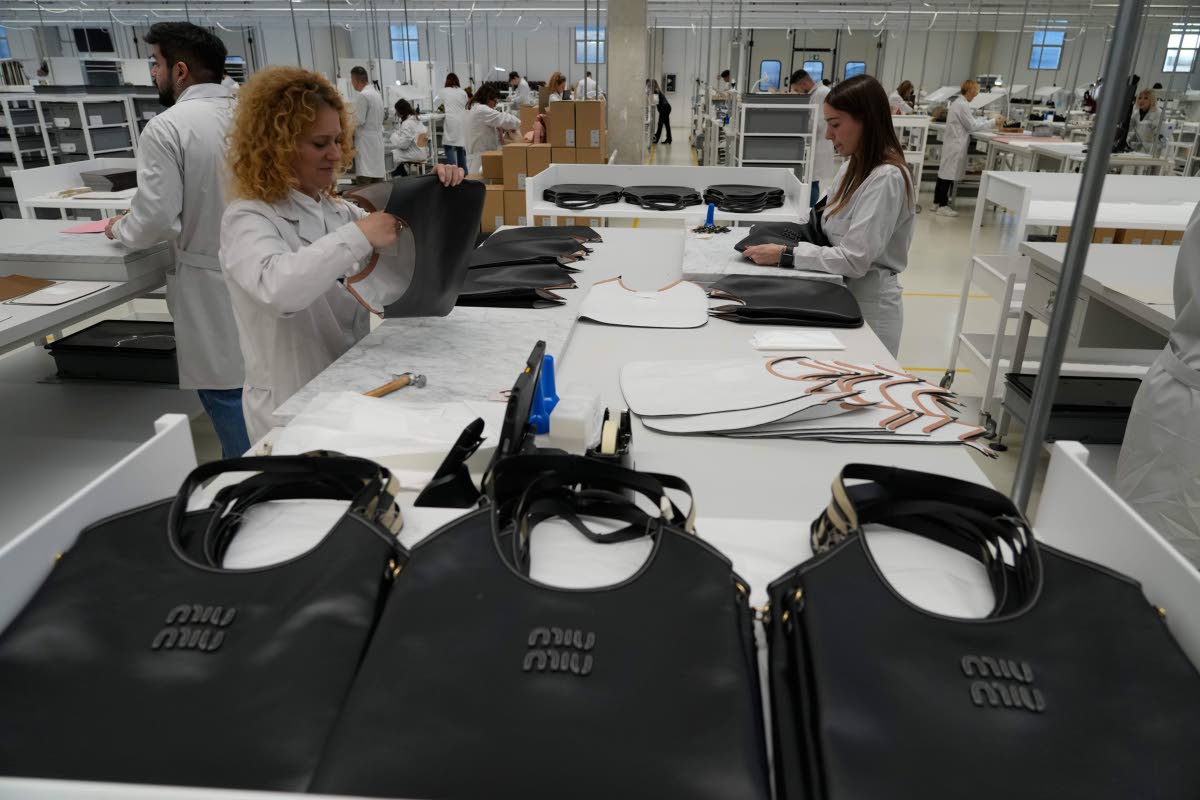 Leather good operators work at the Prada factory in Scandicci, Italy, on Friday, November 28, 2025.