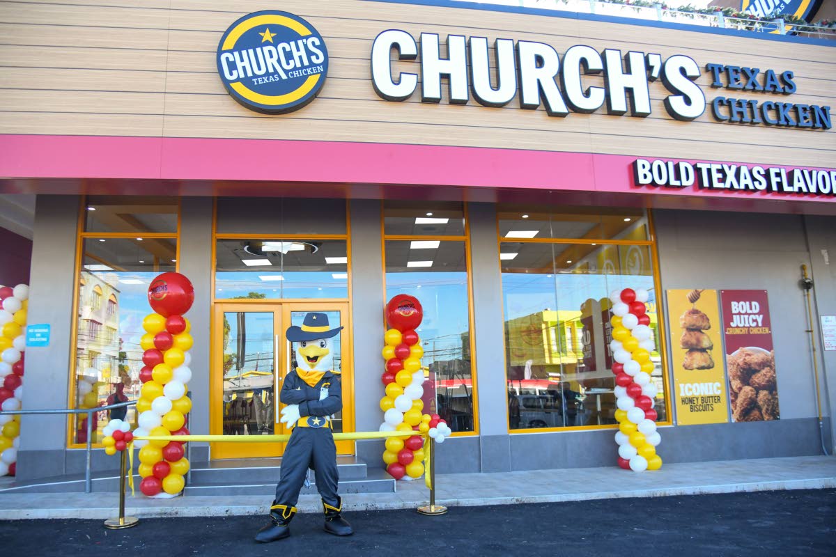 The Church’s Texas Chicken mascot, Sheriff Churchy, stands in front of the eatery at the opening of the franchise’s first store at Mall Plaza, Constant Spring Road, Kingston, on December 8, 2025.