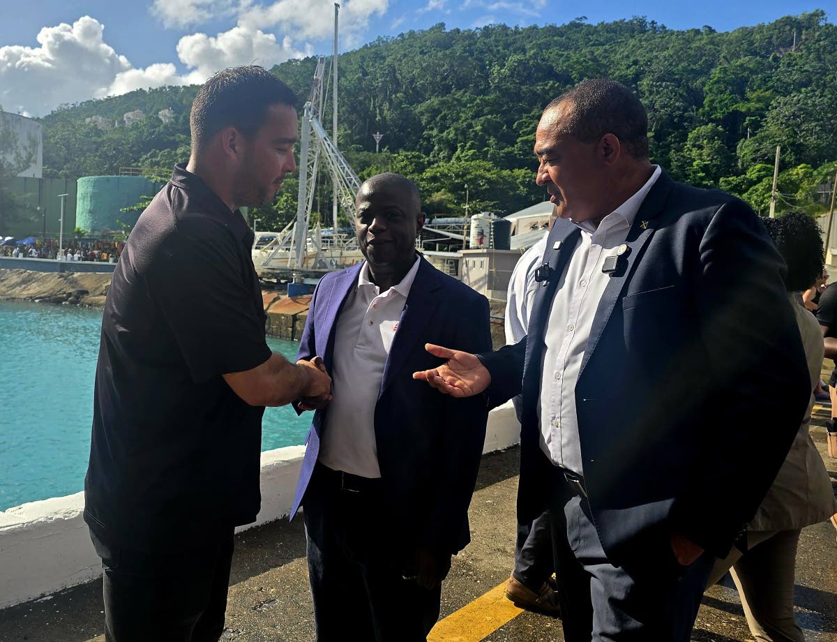 From left: Direct Relief’s response manager Luis Rodriguez greets National Health Fund’s executive director Everton Anderson and Minister of Health and Wellness Dr Christopher Tufton during the handing over of medical relief supplies valued at US$1 mil