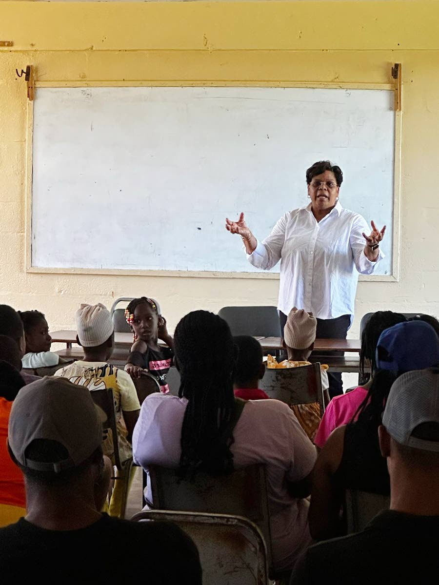 Dr Marsha Smith making a presentation to grandparents, parents and children at the Newell High School in St Elizabeth. 