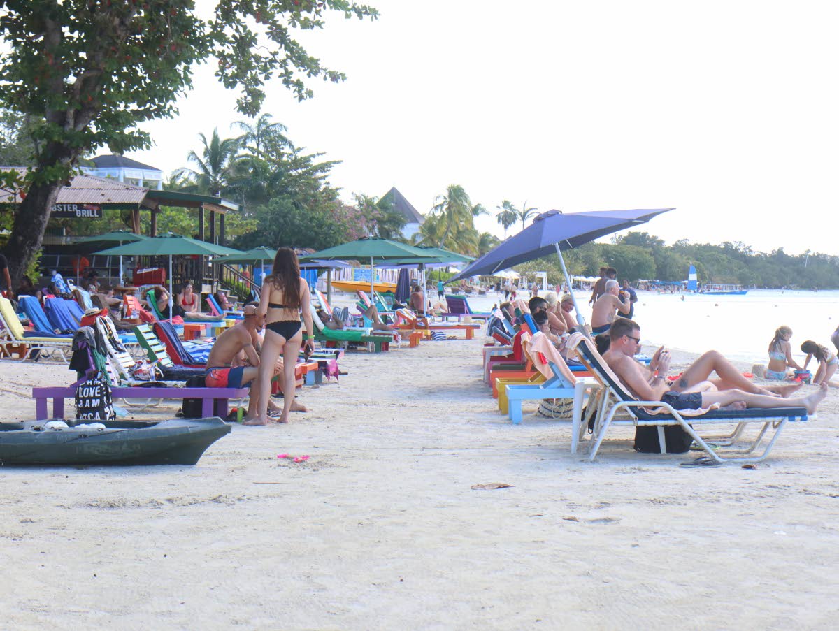 Visitors seen on the beach in Negril on December 27, 2021.