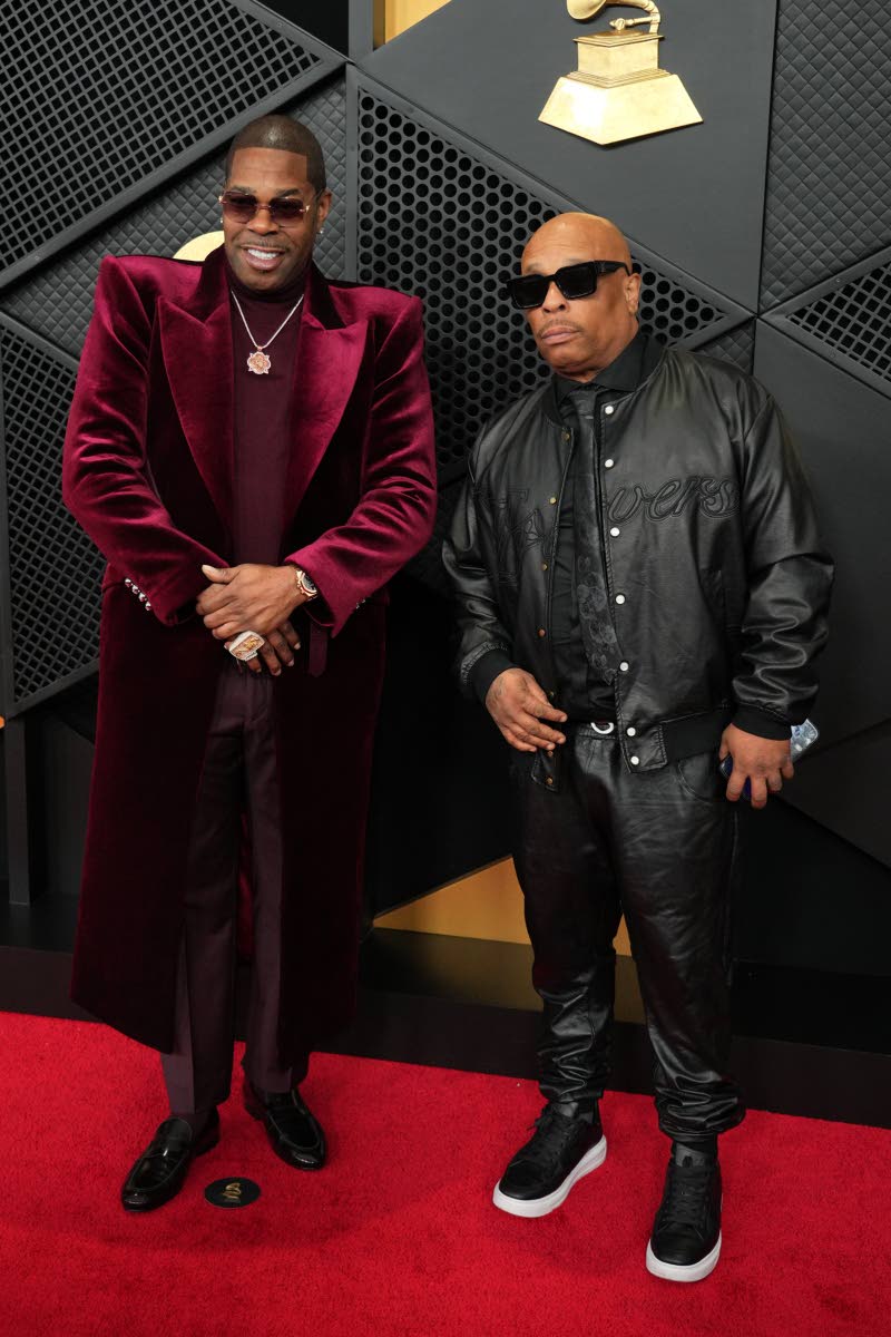 A swaggering Busta Rhymes (left) hits the awards show with long-time friend and fellow rapper Spliff Star.
