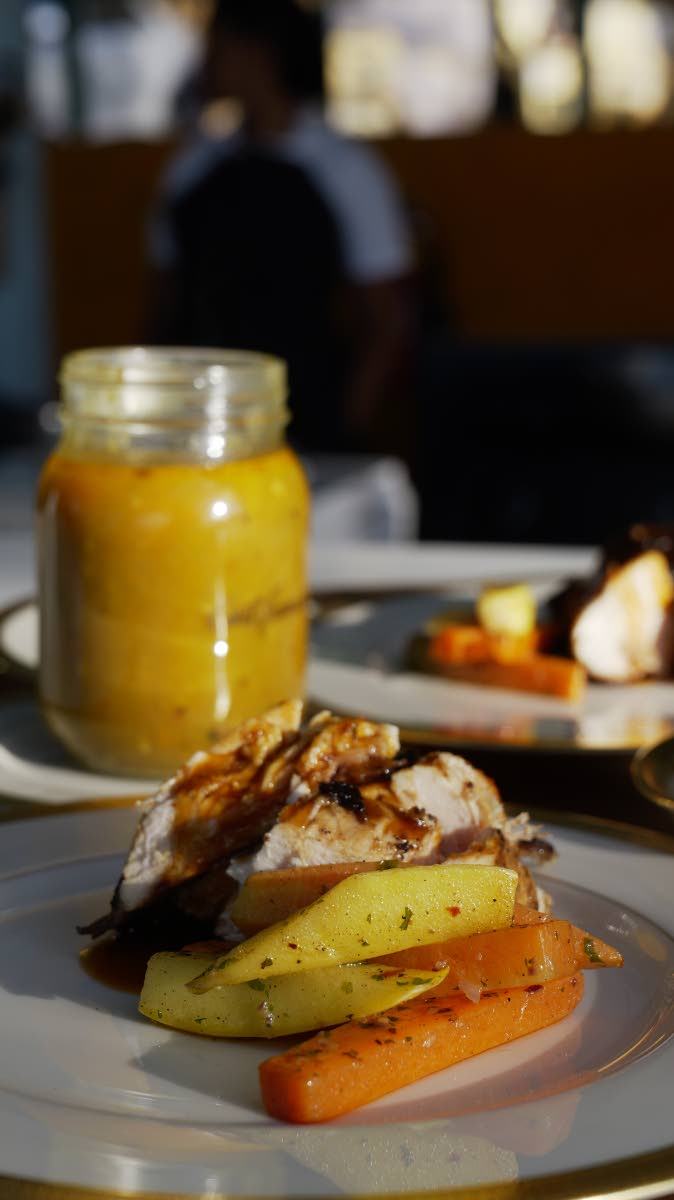 Spicy bourbon chicken served with a side of sauteed garlic butter vegetables and beef pumpkin soup. 
