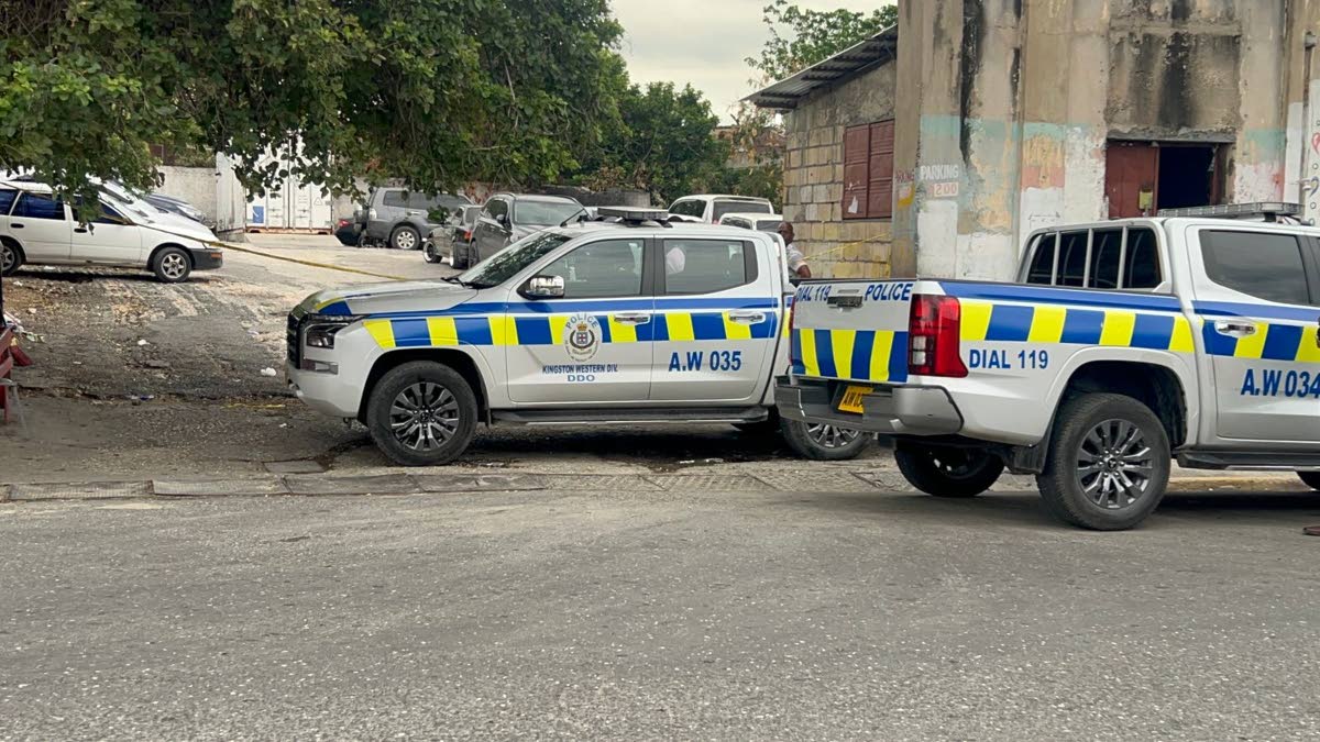 The unofficial parking area adjacent to the Kingston Public Hospital was cordoned off by police yesterday after 30-year-old Damion Henry was shot and killed by gunmen.