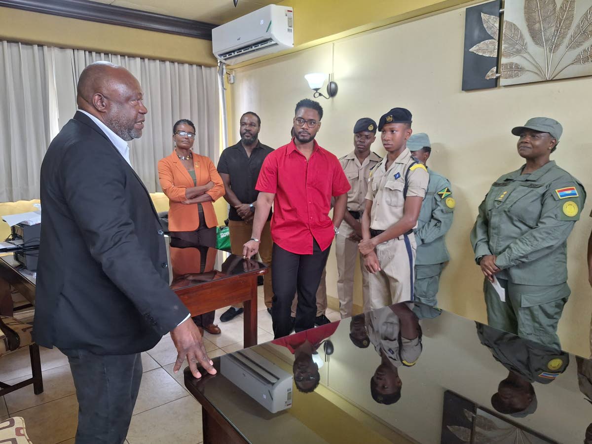 Leroy Grey, assistant district grand master of the Freemason Association of Jamaica and the Cayman Islands, delivers a pep talk to members of the Cornwall College administration, the school’s Cadet Unit, and his fellow brothers in the Freemason Associati