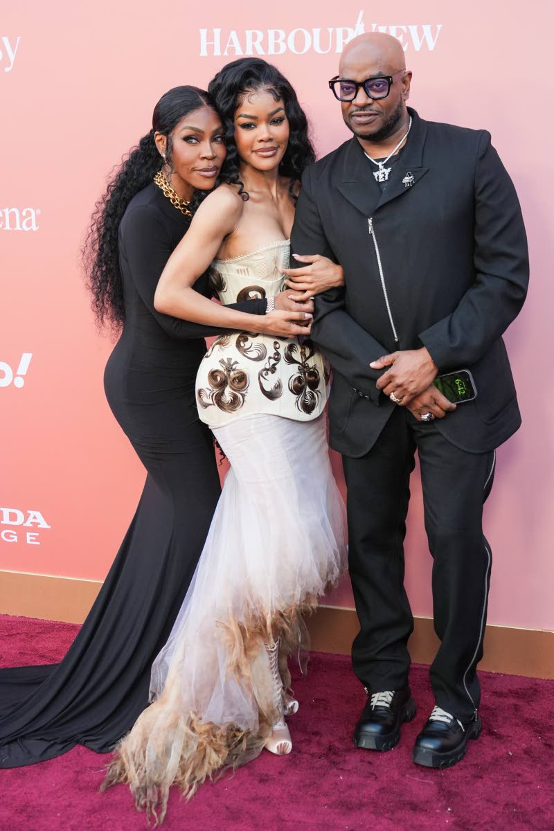 Teyana Taylor (centre) shares a moment with parents Nikki Taylor (left) and Boe Daney.