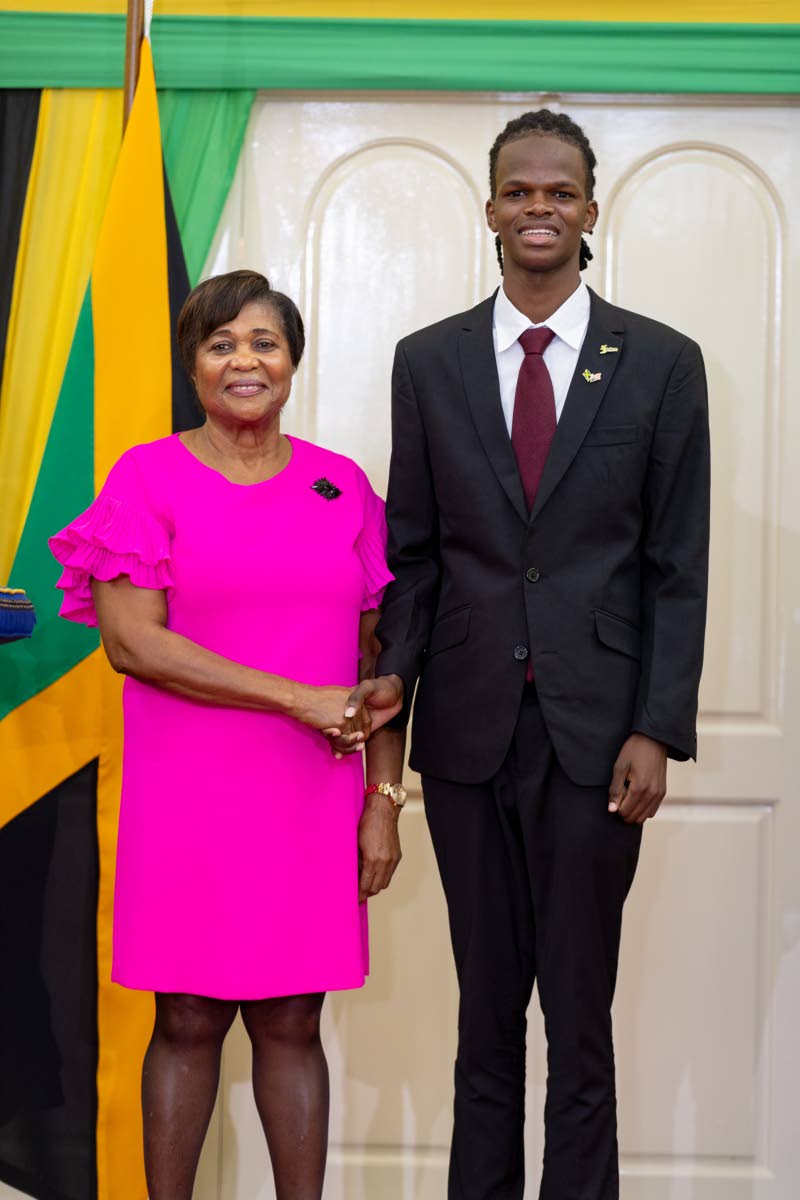Justin Wallace, inducted as IBI Ambassador by Lady Allen, the wife of the Governor General.