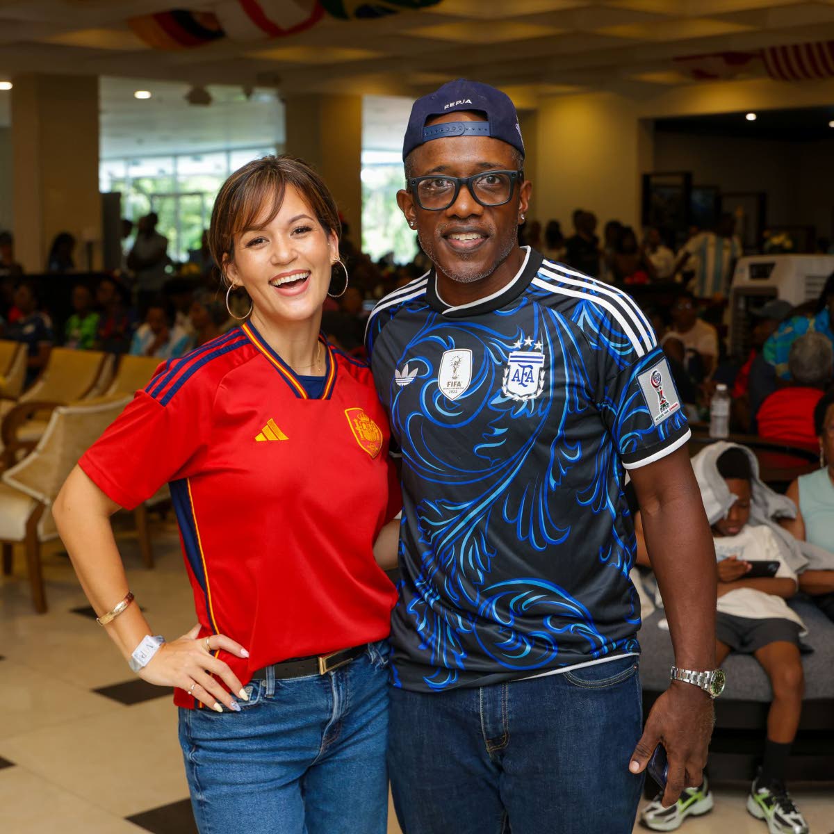 Husband-and-wife duo Wayne Mitchell and Tami Chin Mitchell pause their hosting duties for a quick photo.