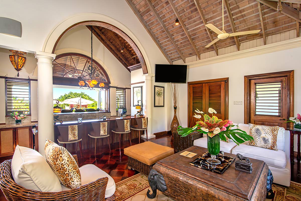 The wet bar serves both indoor and outdoor living spaces. 