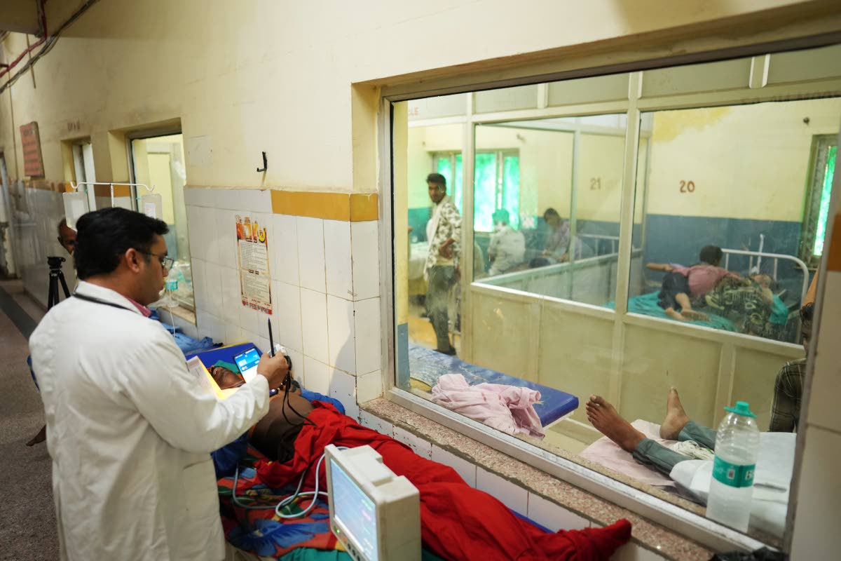 Dr Abhishek Pranayami examines a patient suffering from a heat-related illness amid high temperatures at a district government hospital in Banda, northern Indian state of Uttar Pradesh, on Friday, June 19.