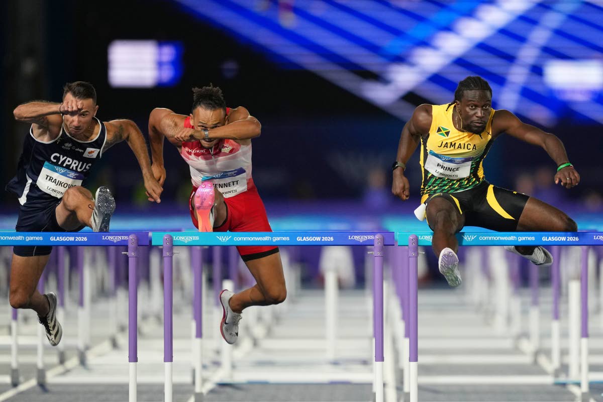 Demario Prince, of Jamaica (right), clears a hurdle ahead of Samuel Bennett, of England (centre), and Milan Trajkovic, of Cyprus, on his way to winning the gold medal in the men’s 110-metre hurdles final at the Commonwealth Games in Glasgow, Scotland, ye