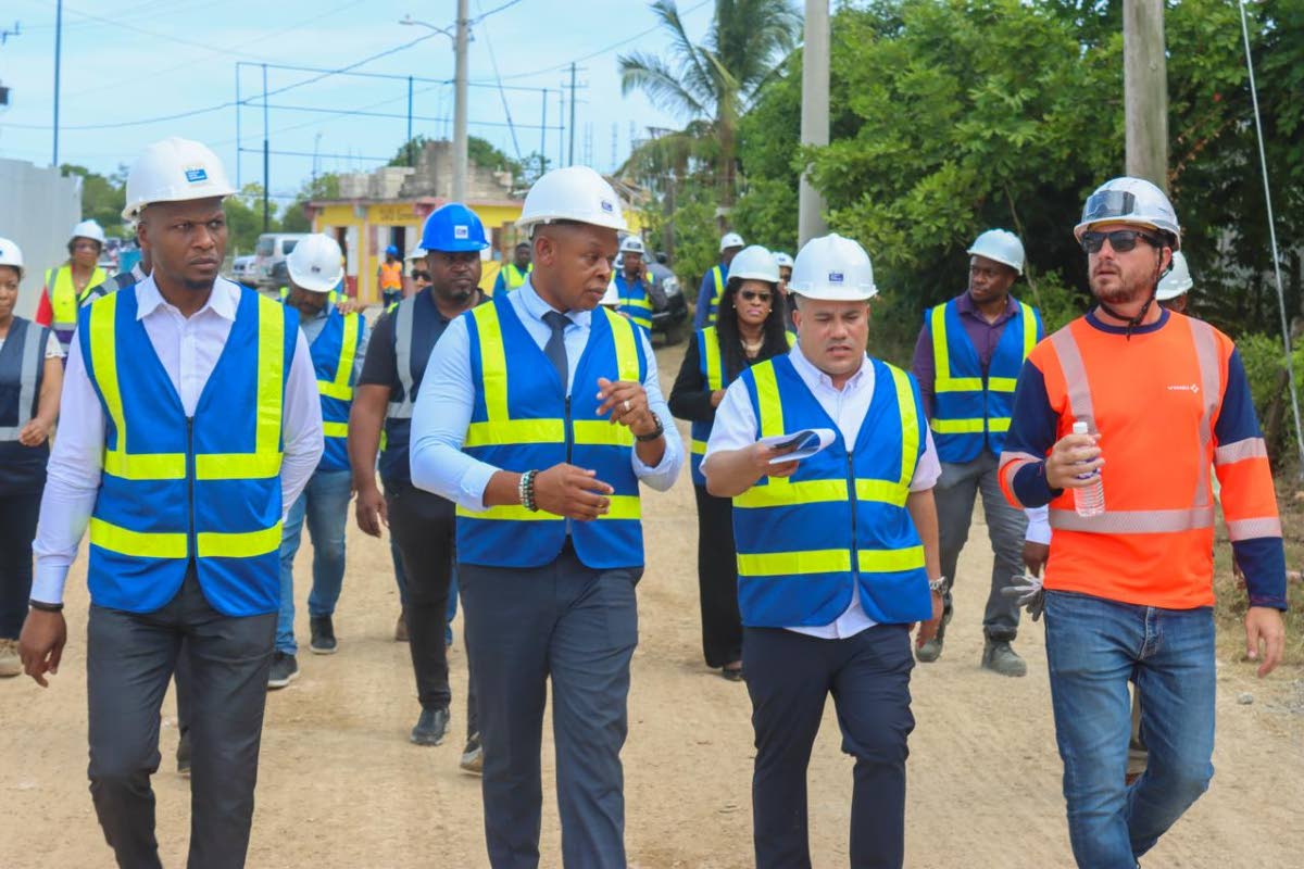 From left: Wayne Robertson, permanent secretary in the Ministry of Water, Environment and Climate Change; Kevin Kerr, acting president of the National Water Commission; Matthew Samuda, minister of water, environment and climate change; and Timothée Deleba