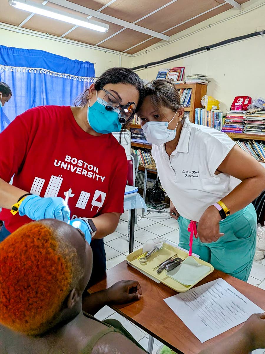 Health professionals examine a patient’s eyes during a Zion Care International medical outreach.
