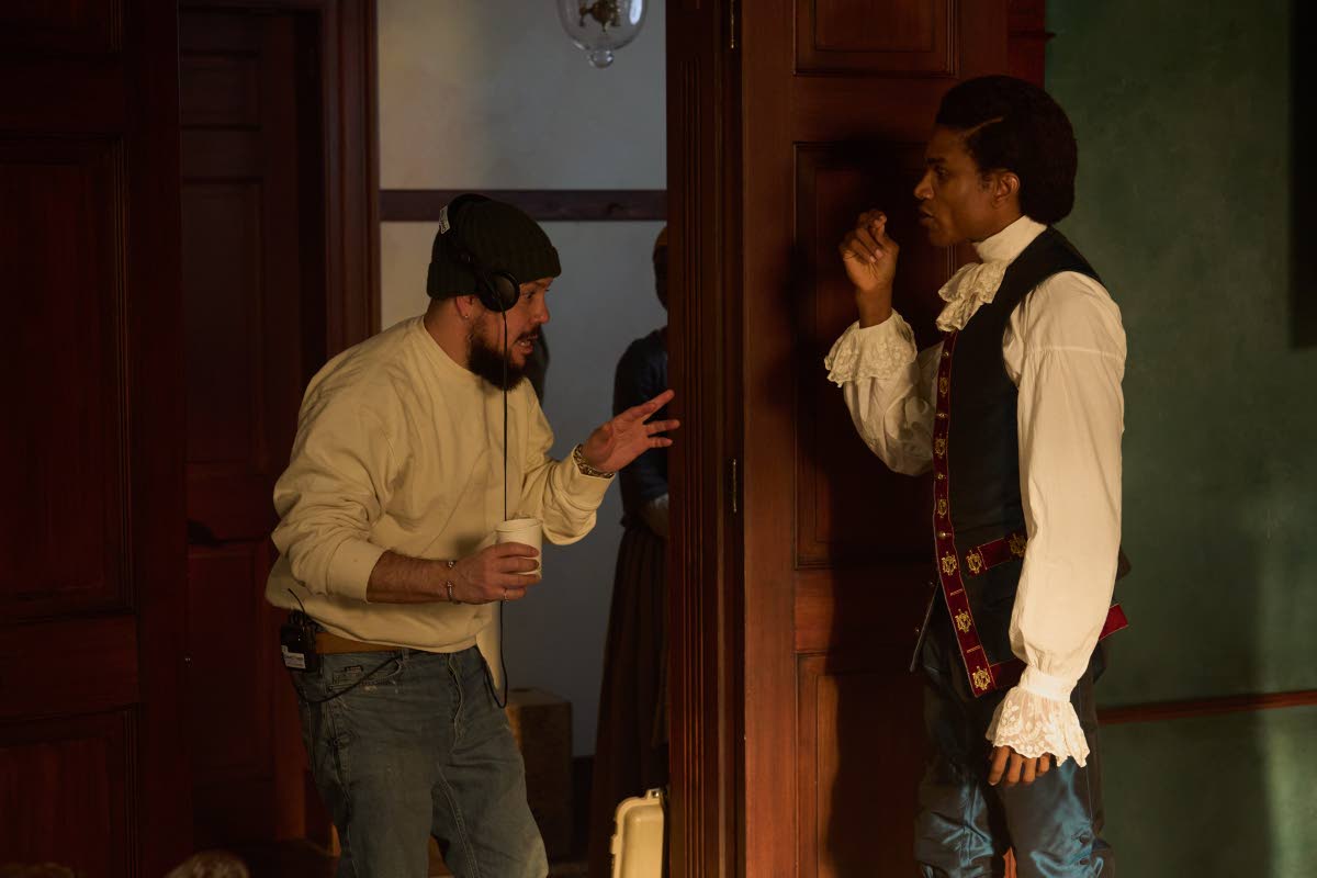 Director Storm Saulter (left) prepares for a scene with actor Sheldon Shepherd during filming of the upcoming Sky Atlantic miniseries ‘Possession’, which was shot at multiple locations across Kingston and St Ann last year. 