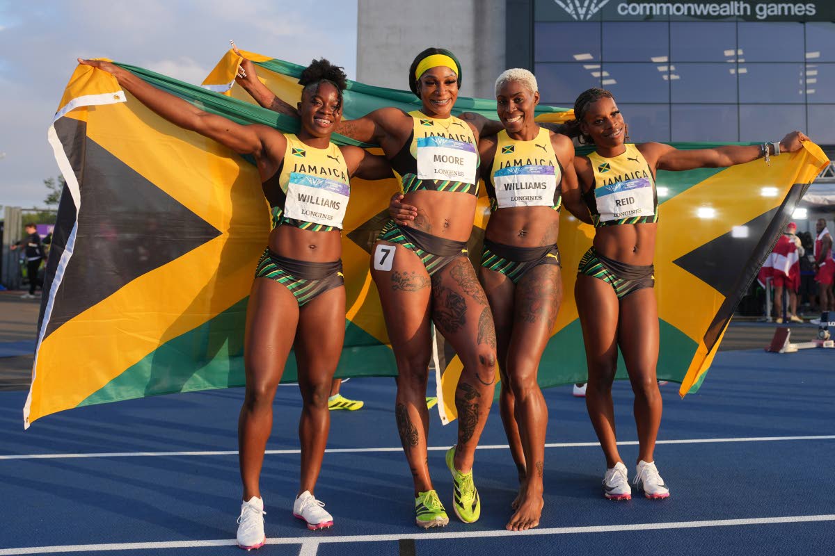 From left: Lavanya Williams, Ashanti Moore, Jodean Williams, and Alana Reid pose after winning the gold medal in the women’s 4X100-metre relay at the Commonwealth Games in Glasgow, Scotland, yesterday.