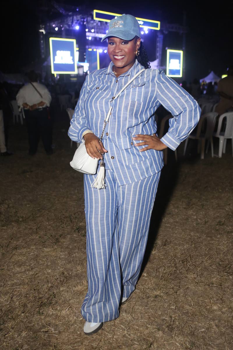 Zelia Gibson-Brown, scheduling and insurance coordinator at Jamaica Cosmetic Dental Services, wears a striped two-piece set that strikes the perfect balance between style and comfort.
