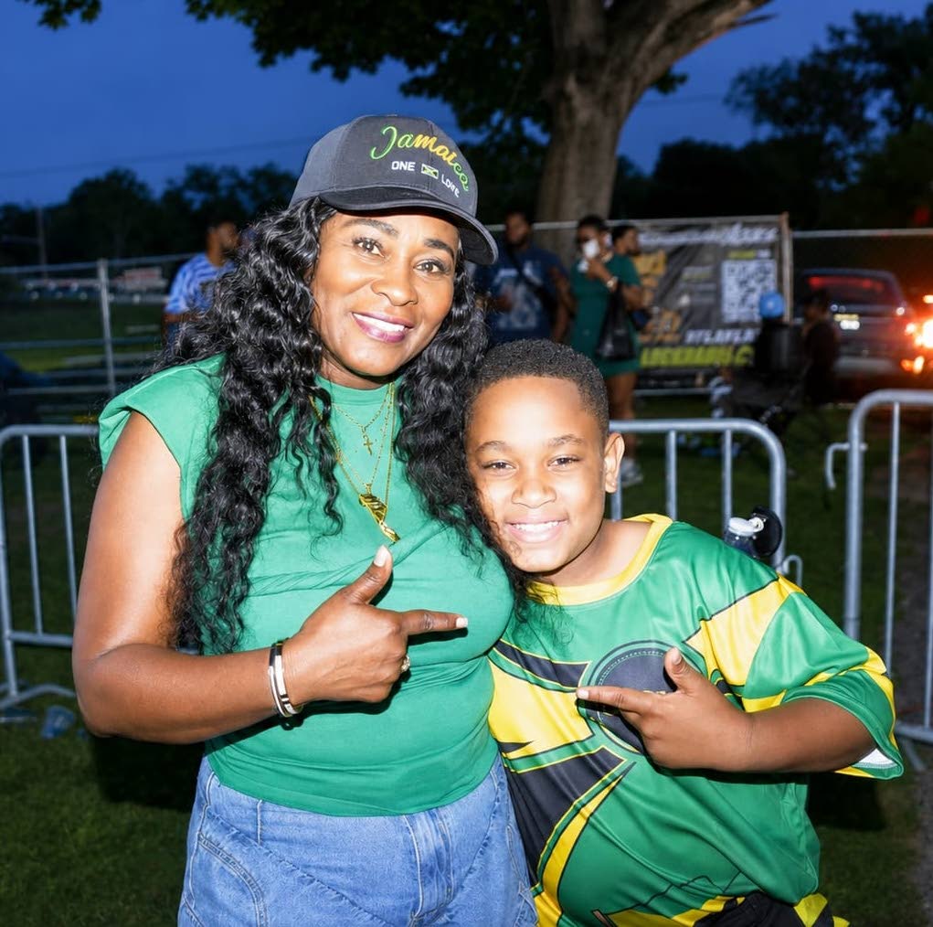 Lady G poses with 10-year-old singer RJ following their duet of ‘Thank You’, the 1995 gospel hit produced by Philip ‘Fatis’ Burrell, at the 10th annual Jamaica Day Celebration at Eastside Park in Paterson, New Jersey, on August 1.