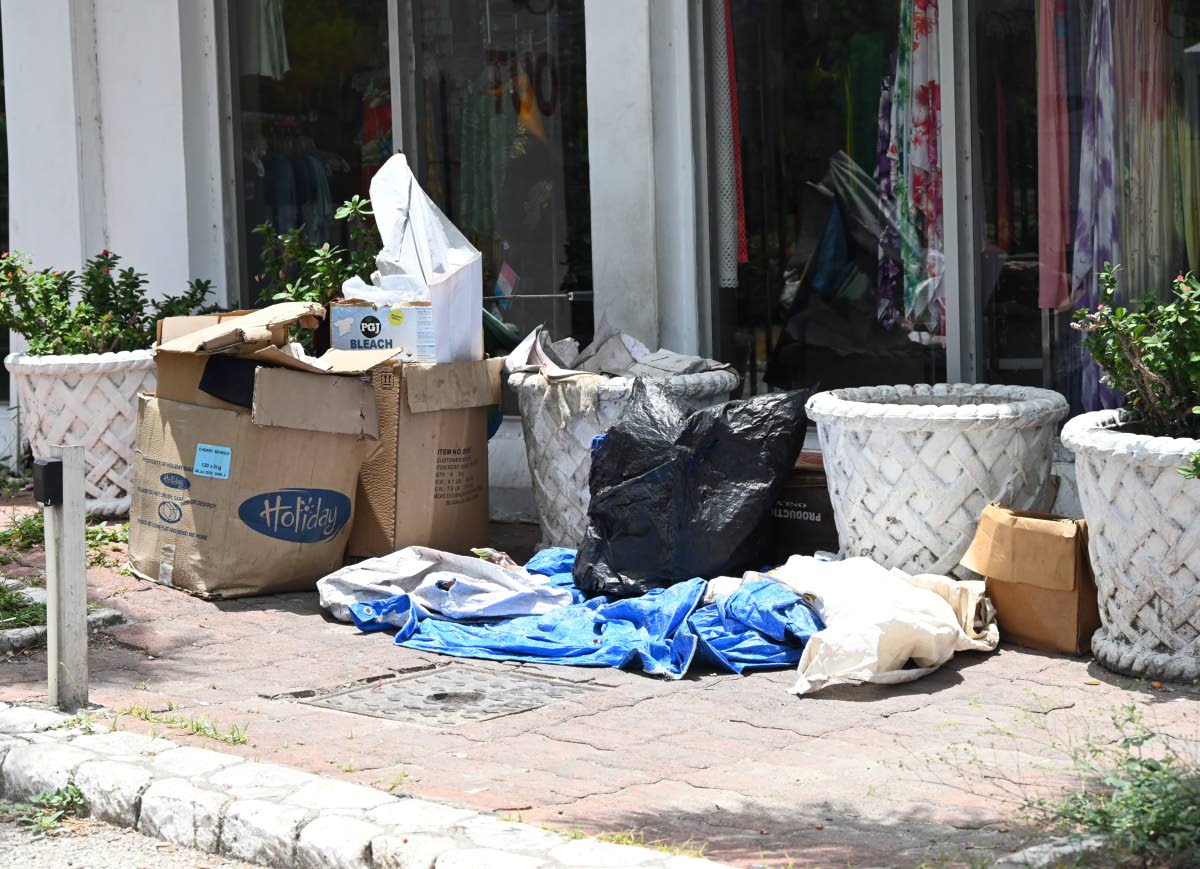 Items belonging to a homeless person are arranged in a makeshift living space near the Royal Decameron Montego Bay Beach Resort along Jimmy Cliff Boulevard in Montego Bay, St James, on Friday.