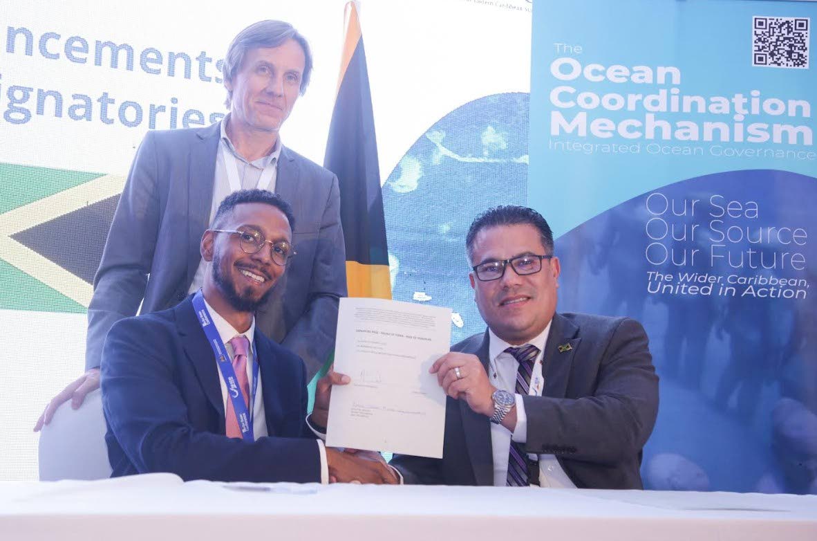 Matthew Samuda (right), minister of water, environment and climate change from the Government of Jamaica, signs the Wider Caribbean Ocean Coordination Mechanism MOU at the Our Oceans Conference in Mombosa, Kenya. 