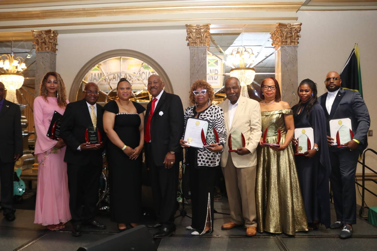 Chargé d’Affaires ad interim at the Embassy of Jamaica in Washington, DC, Lishann Salmon (third left), and JAM President Ricardo ‘Rick’ Nugent (sixth right) share a light moment with the 2026 JAM awardees following the presentation ceremony at the J