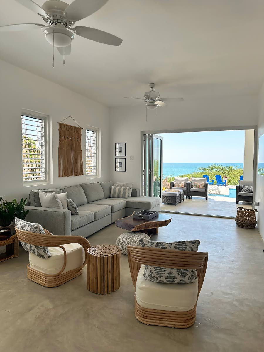 Enjoy pool and sea vistas from the living room.