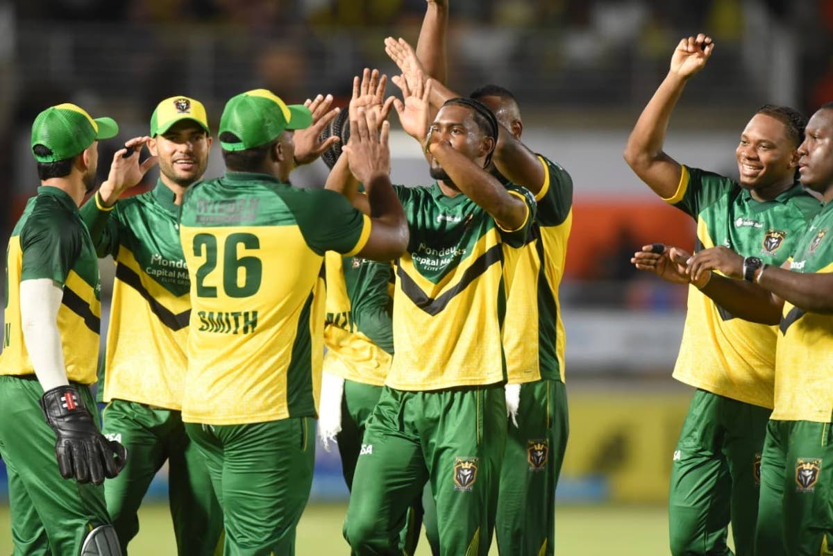 The Jamaica Kingsmen celebrate a wicket during their Republic Bank Caribbean Premier League T20 game against the Trinbago Knight Riders at Sabina Park earlier tonight.