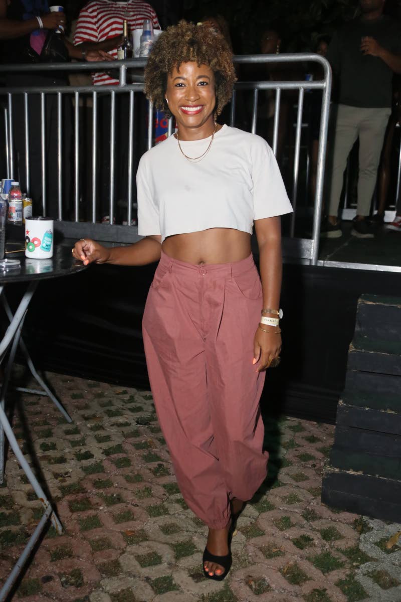 Lisa Wilson of Lisa W Design Studio steps out at FRi~NALLY for a Friday night out in a white crop top, brick-pink high-waisted parachute pants and black mules.