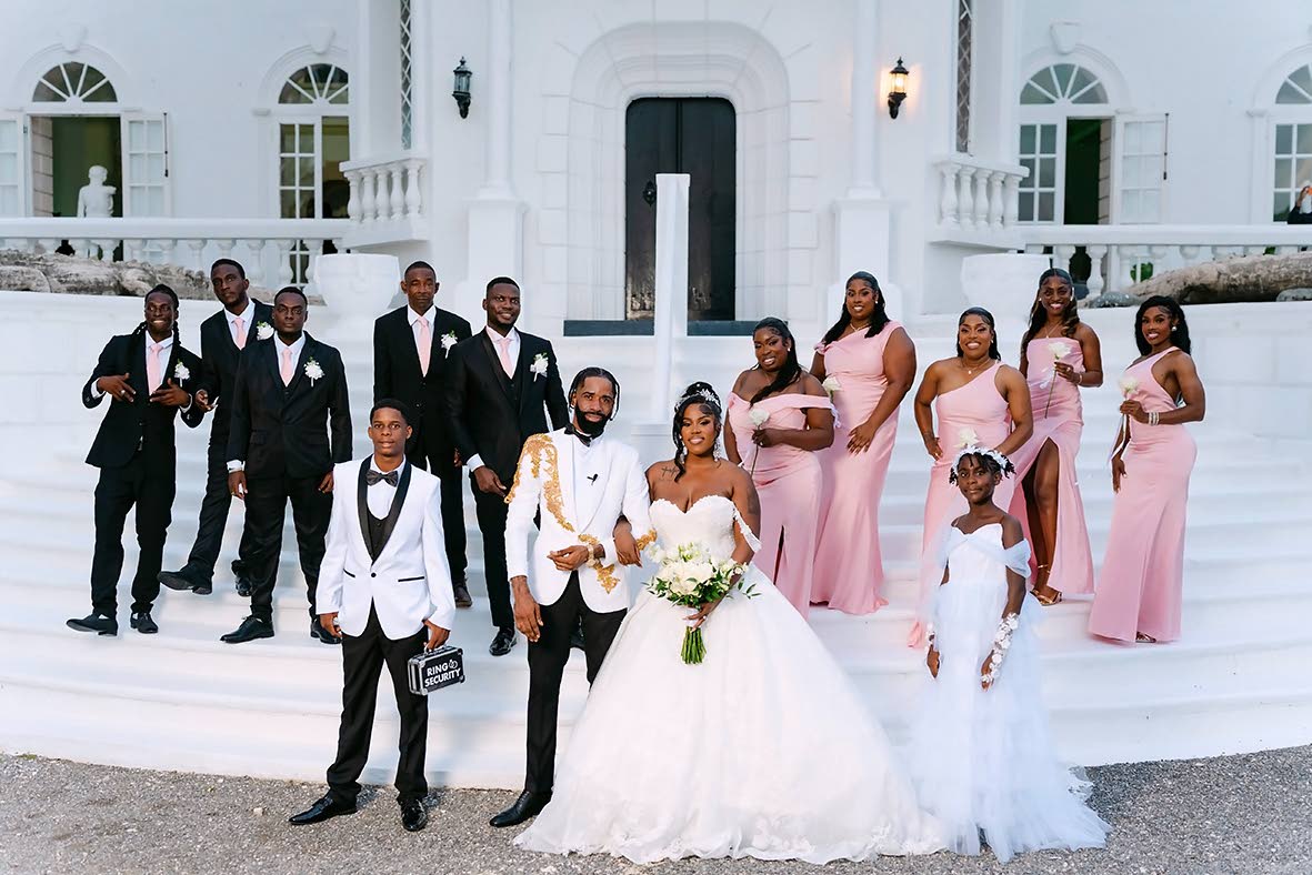 Introducing the Officers’ wedding party. From left are groomsmen Dwayne Mendez, Davar Chambers, Ras Whitely, Linval Officer and Rushawn Johnson, followed by bridesmaids Natasha Brown, Brionnah Robinson, Sanique Percy, Nisha Nun and Marcie Lafrance. In th
