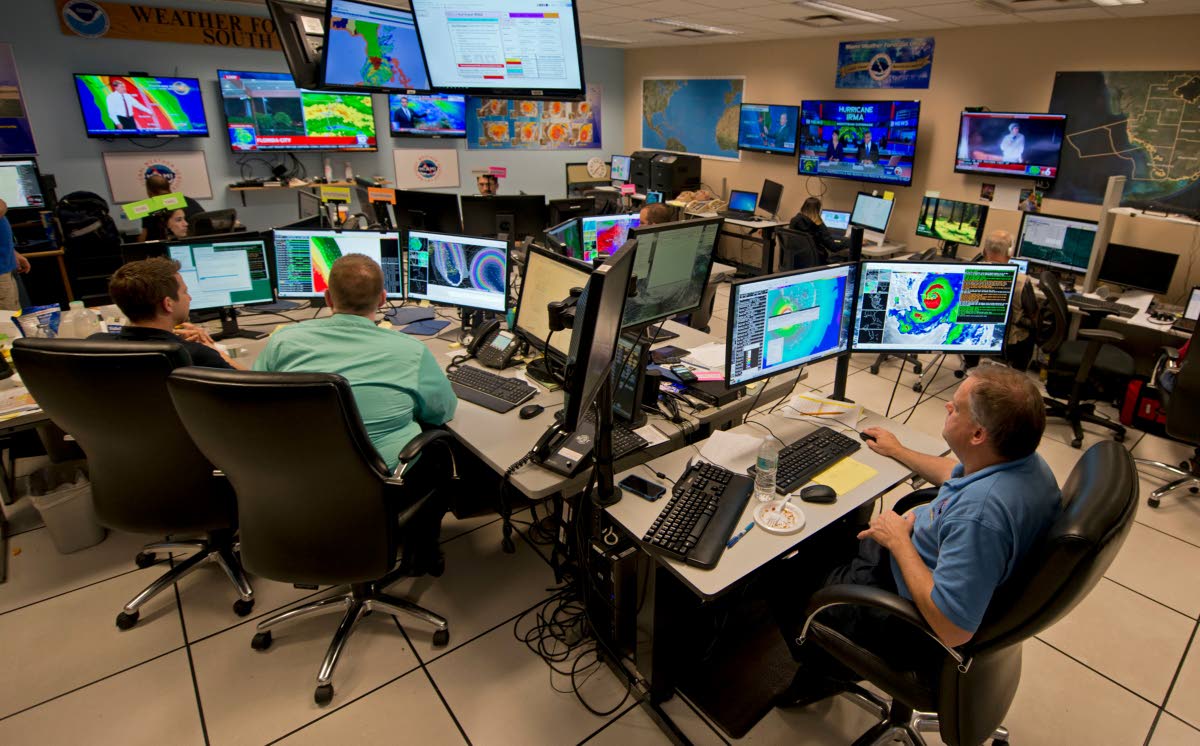 Forecasters at the National Weather Service office monitor Hurricane Irma on September 9, 2017 at the hurricane centre in Miami. 