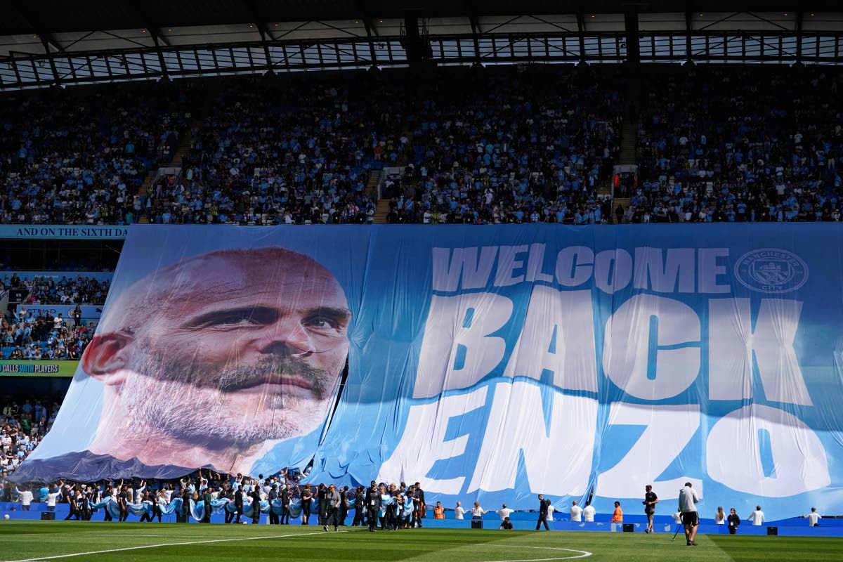 Manchester City fans display a tifo for Manchester City's head coach Enzo Maresca ahead of the English Premier League soccer match between Manchester City and Bournemouth in Manchester, England, Sunday, Aug. 23, 2026. (AP Photo/Dave Thompson)