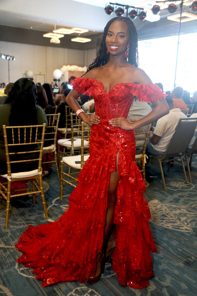 Model Emily Hall is stunning in red as she gives her support to the contestants.