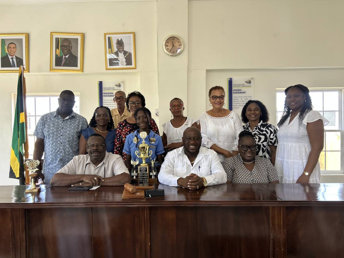 From left to right (front): Custos Hartley Perrin; Khadijah Wright, winner of the LMAJ essay competition; Westmoreland Mayor Danree Delancy; Marlet Wellington, acting CEO. Back row (from left): Garth Wright, father; Nadine Wright, mother; LMAJ Secretary He