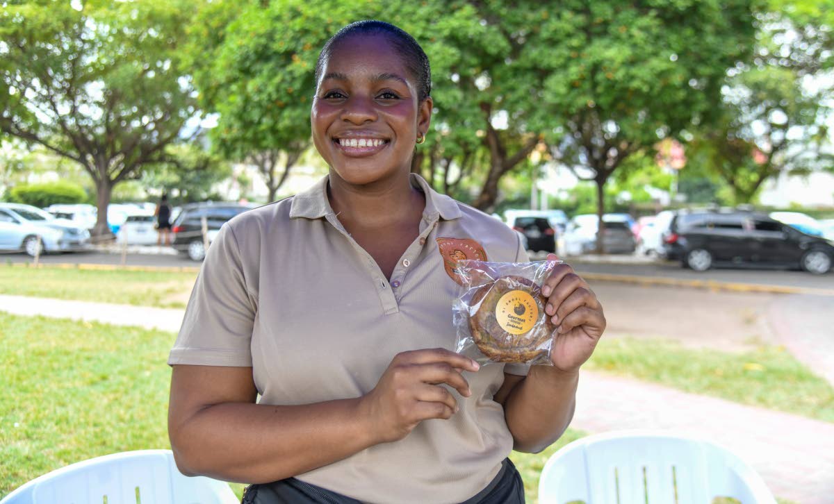Chief Cookie Officer Debra-Ann Willis serves up smiles alongside one of Di Drool Factory’s snickerdoodles during the brand’s Devon House pop-up.