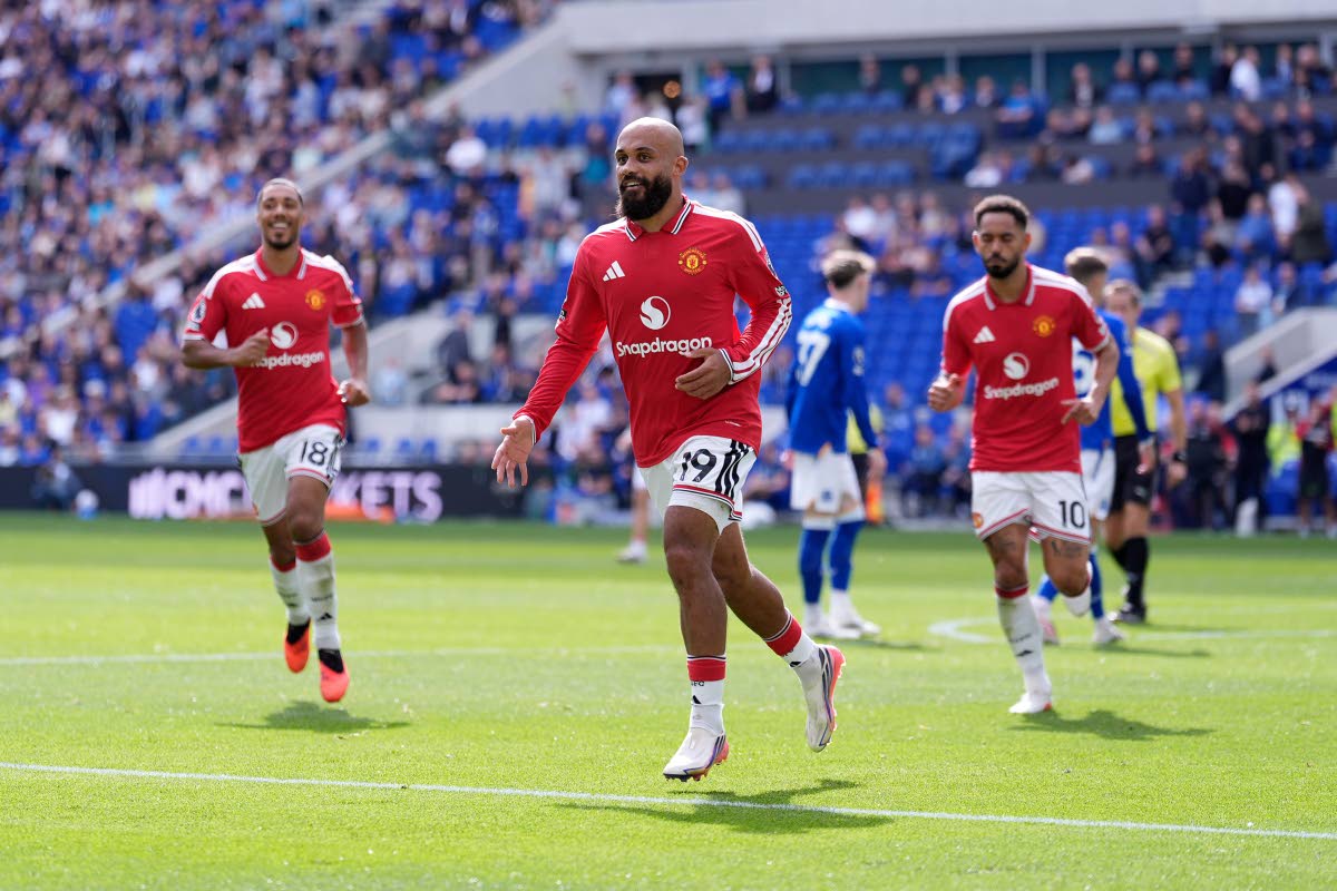 Manchester United's Bryan Mbeumo celebrates scoring their side's first goal of the game during the English Premier League football match between Everton and Manchester United in Liverpool, England, Sunday, September 6, 2026. (Peter Byrne/PA via AP)