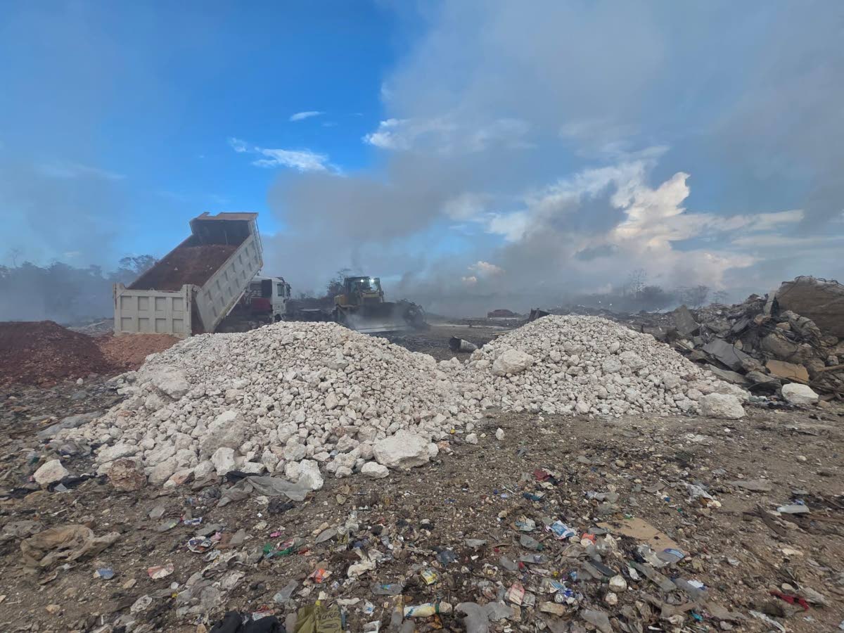 Work crews responding to a fire at the Haddon disposal facility in Moneague, St Ann