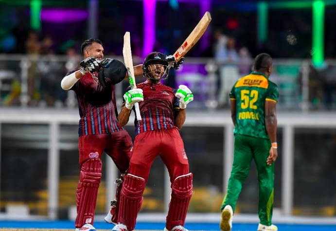 The Antigua and Barbuda Falcons batsmen celebrate their team's victory over the Jamaica Kingsmen at the end of the Caribbean Premier League final at Kensington Oval in Barbados on Sunday night.