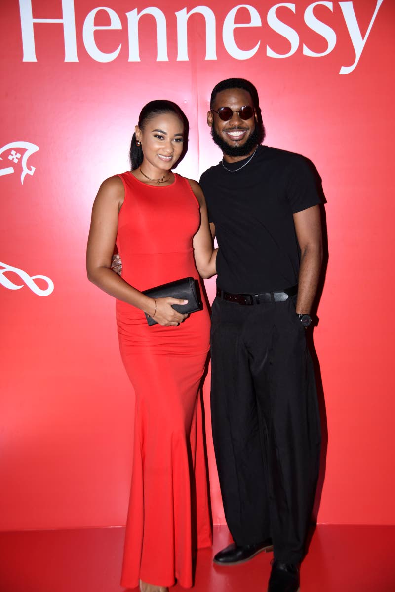 Content creator Joel Youngsang (right) rocks all-black while the lovely Thiana Feanny sparkles in a red mermaid dress.